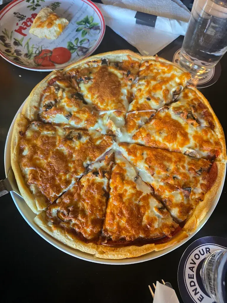 Hand-tossed pepperoni and mushroom pan pizza at DJ's Pizzeria & Lounge in St. Albert, AB