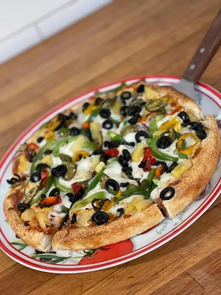 DJ's Special pizza with green peppers, jalapenos, pineapple and black olives - a signature pizza at DJ's Pizzeria in St. Albert