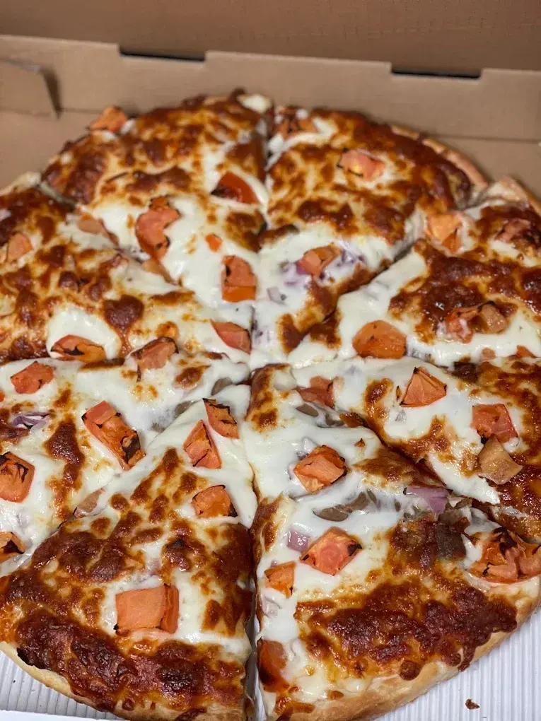 Hot pizza boxed and ready for delivery across St. Albert from DJ's Pizzeria & Lounge